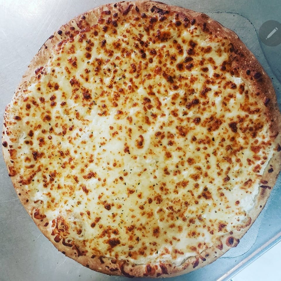 Savor our white pizza